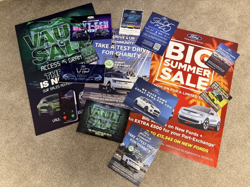 A spread of Ford Foray Motor Group print campaign material including Vault Sale, Big Summer Sale and charity test-drive flyers