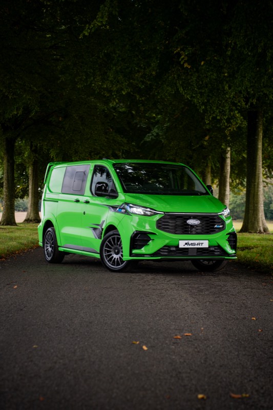 Bright green Ford Transit Custom MS-RT van photographed on a tree-lined avenue